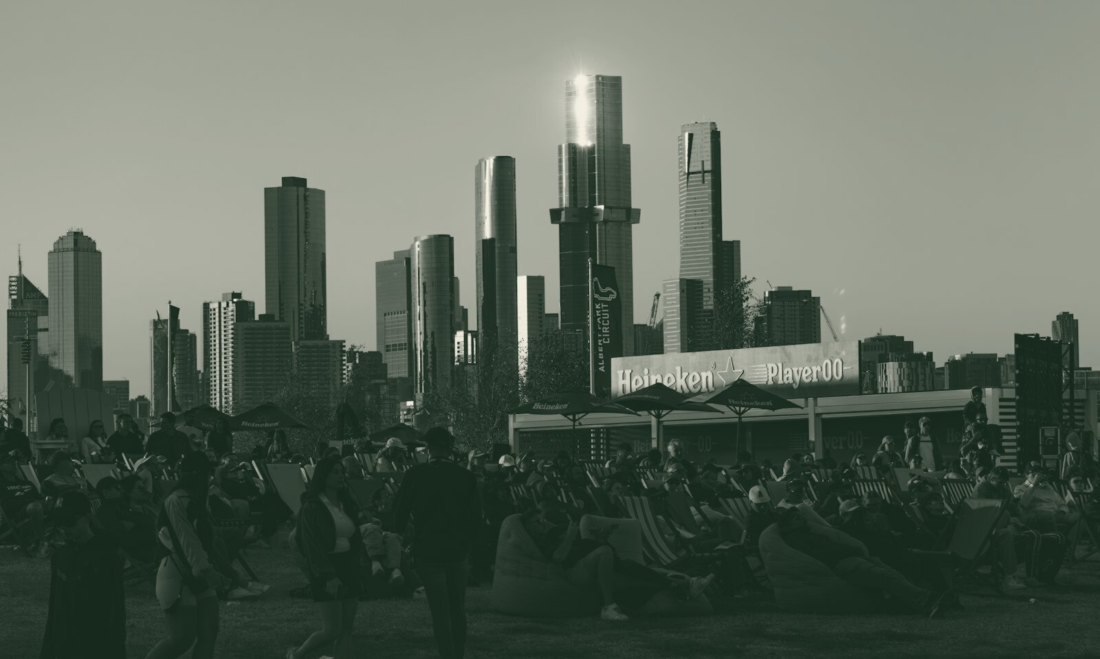A large group of people standing in front of a city