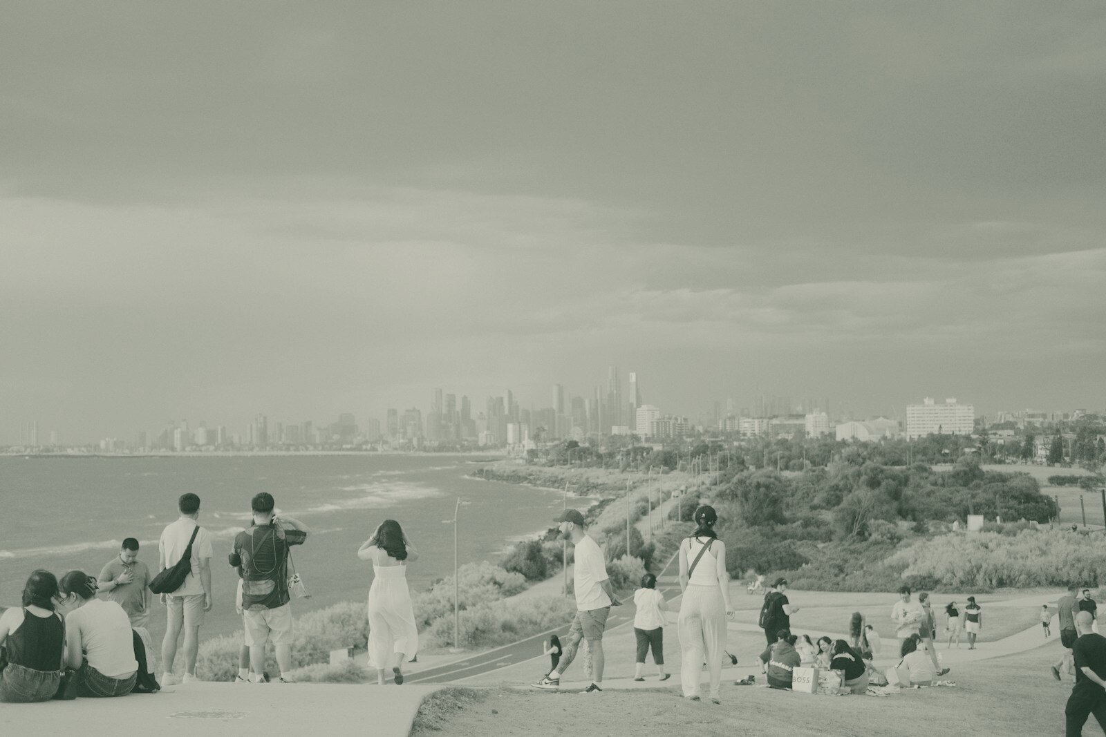 A group of people standing on top of a hill