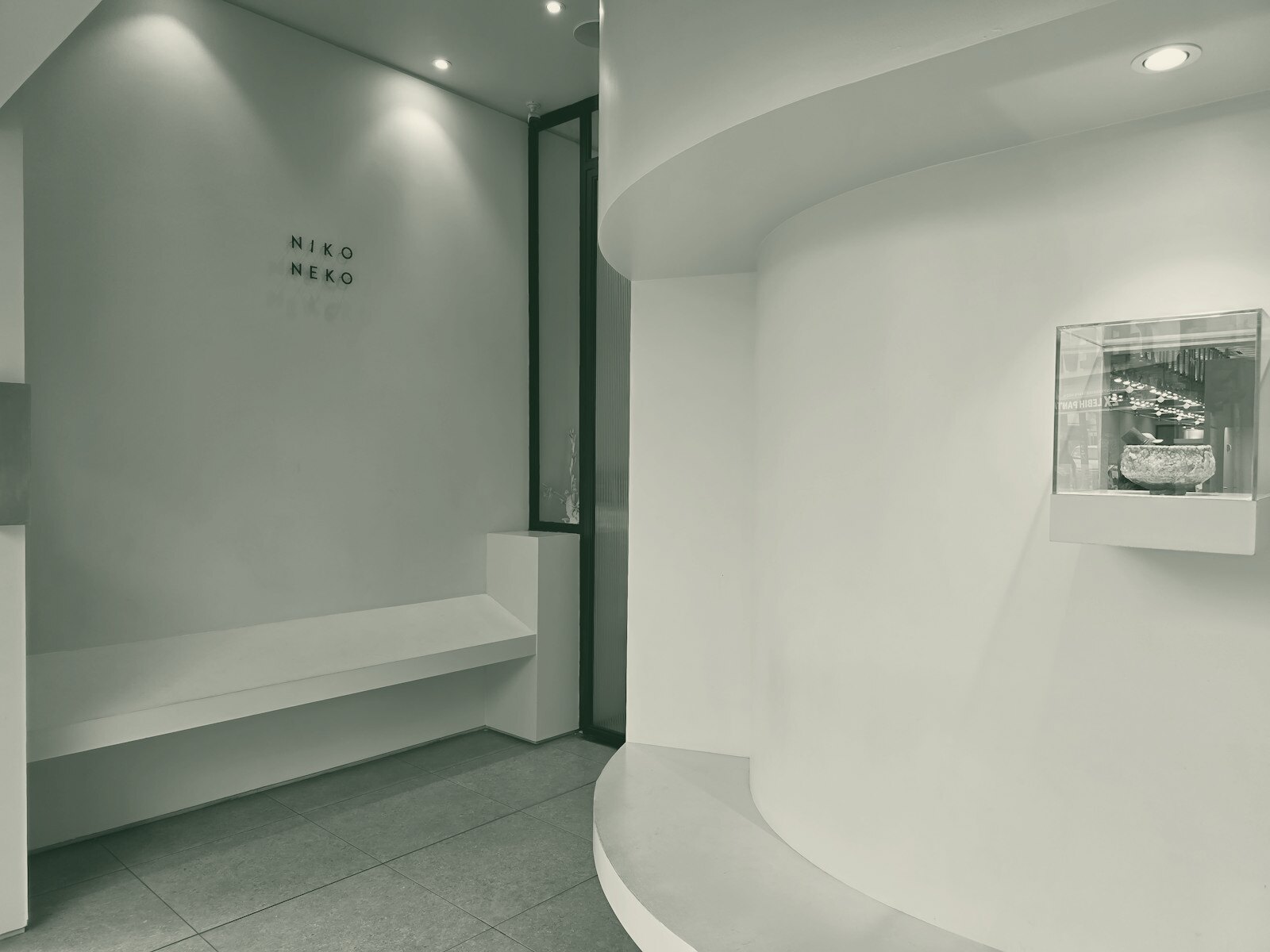 A modern, minimalist interior with clean white walls